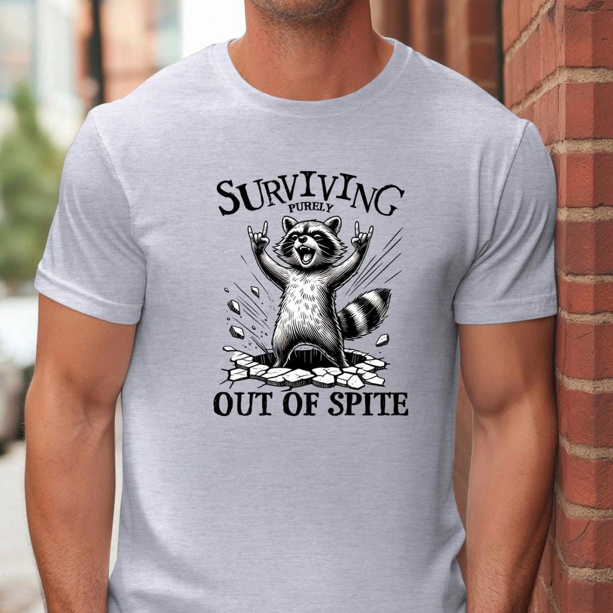 Surviving Out of Spite Raccoon Sweatshirt - Funny Graphic Tee